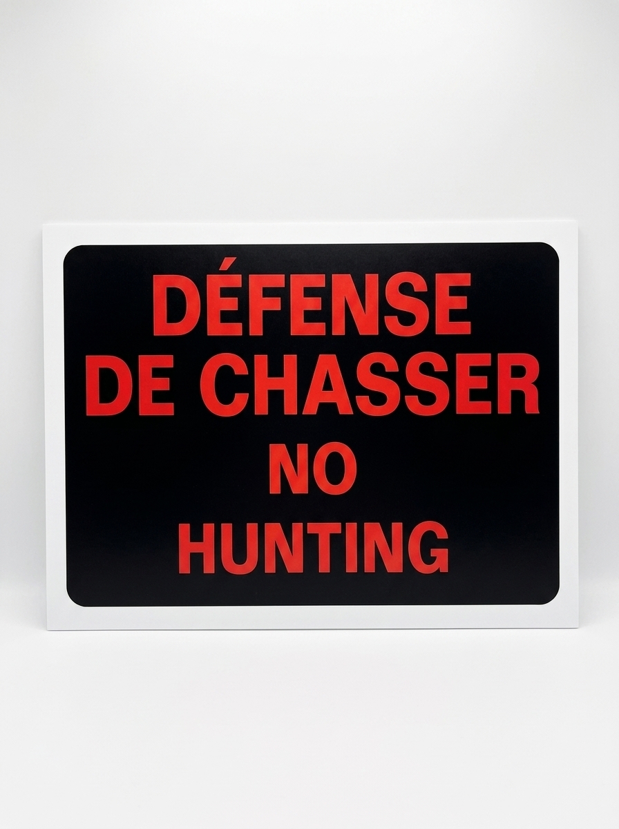Bilingual No Hunting Sign